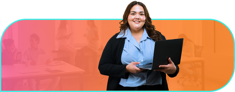 Businessperson holds a laptop and smiles