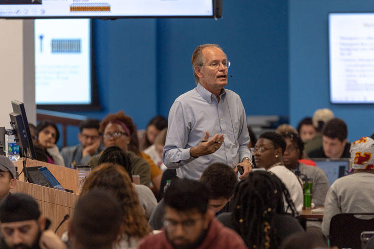 Professor giving lecture in auditorium