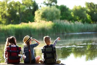 Campers sitting on the lake