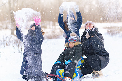 Family playing in snow