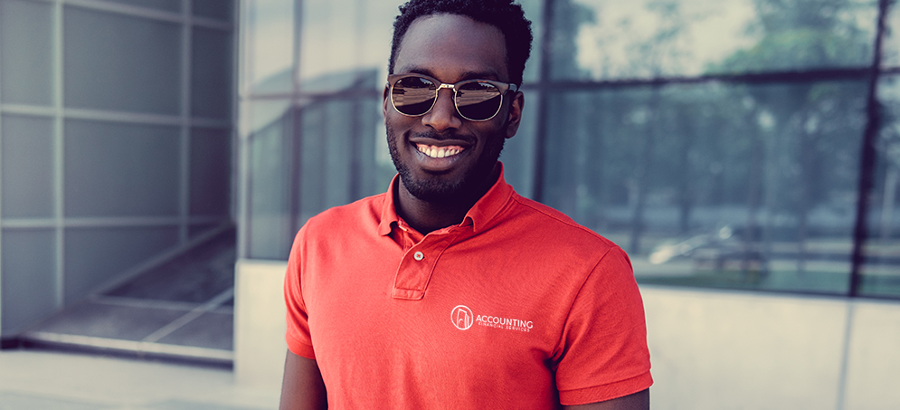 Black male wearing a red polo with Financial logo on it