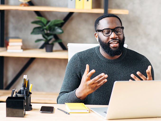 Male giving a virtual presentation on laptop