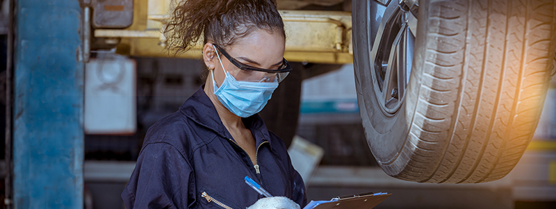 Mechanic checking car