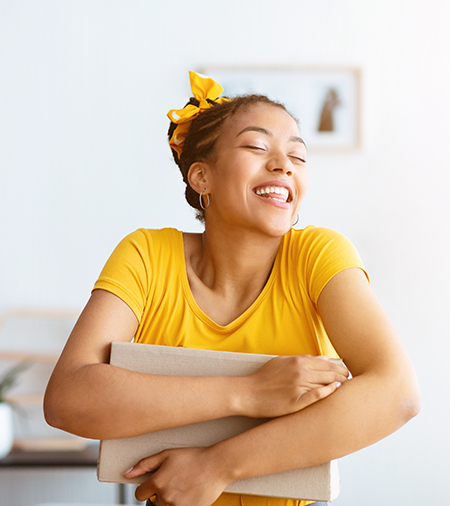 Young adult holding a package