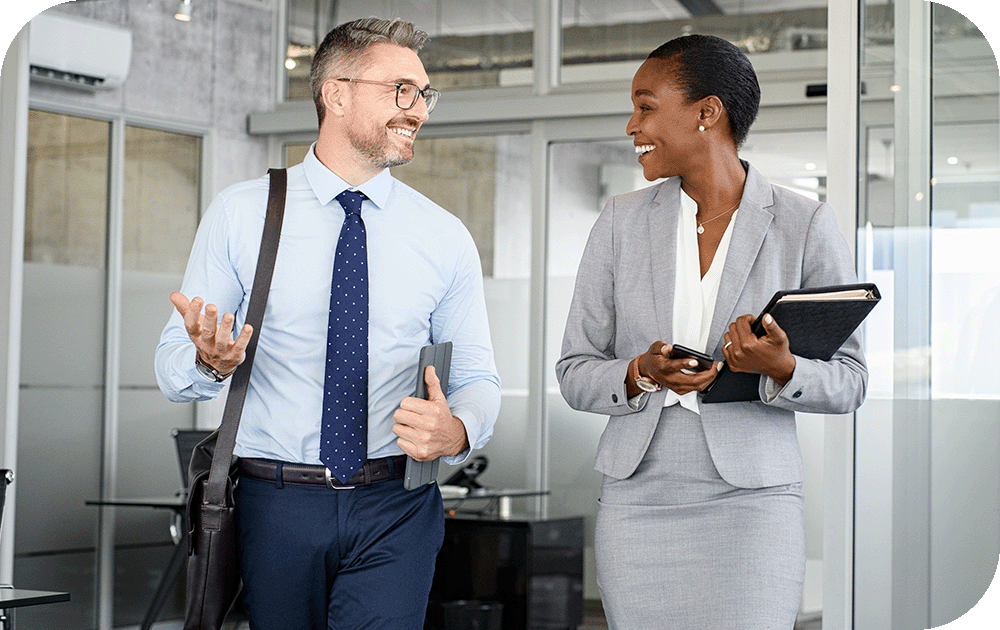 business man and woman walking through office