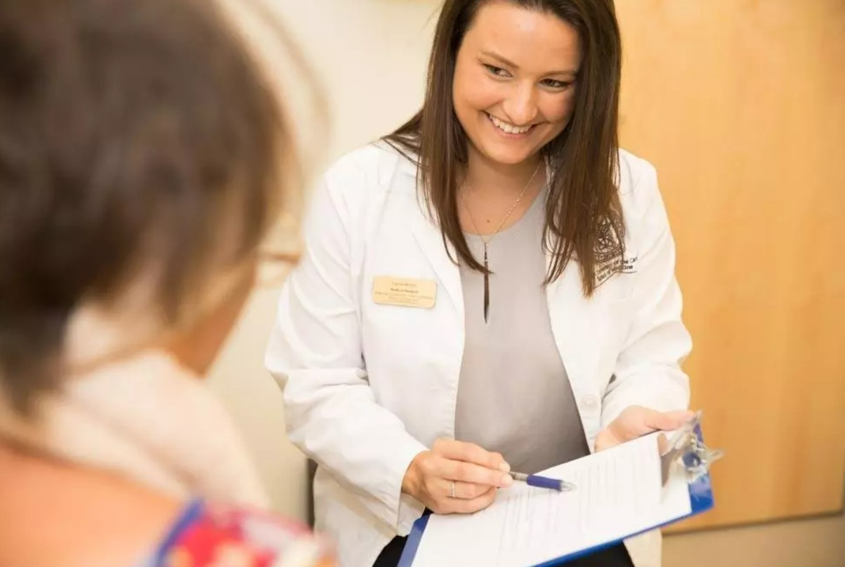 Smiling doctor and patient