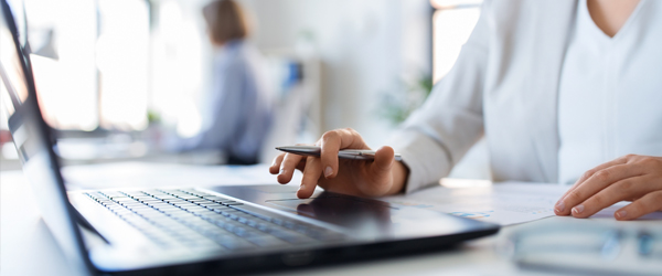 Woman typing on a keyboard