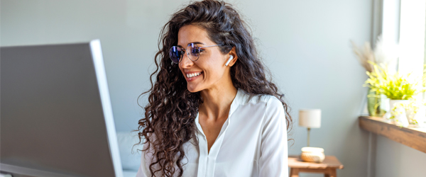 Woman working on desktop computer