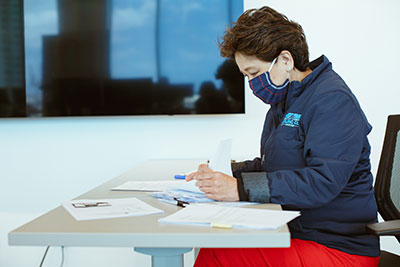 ASB Teammate reviewing paperwork